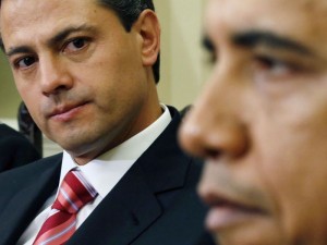 President-elect Enrique Pena Nieto of Mexico looks at U.S. President Barack Obama during their meeting at the Oval Office of the White House in Washington